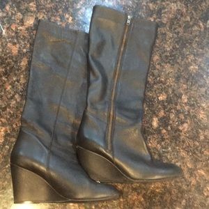Black wedge heel leather boots